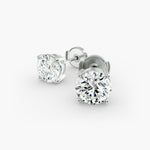 Load image into Gallery viewer, Round Diamond Four‑Prong Stud Earrings 0.50–10.00 CT in 10K/14K/18K White or Yellow Gold
