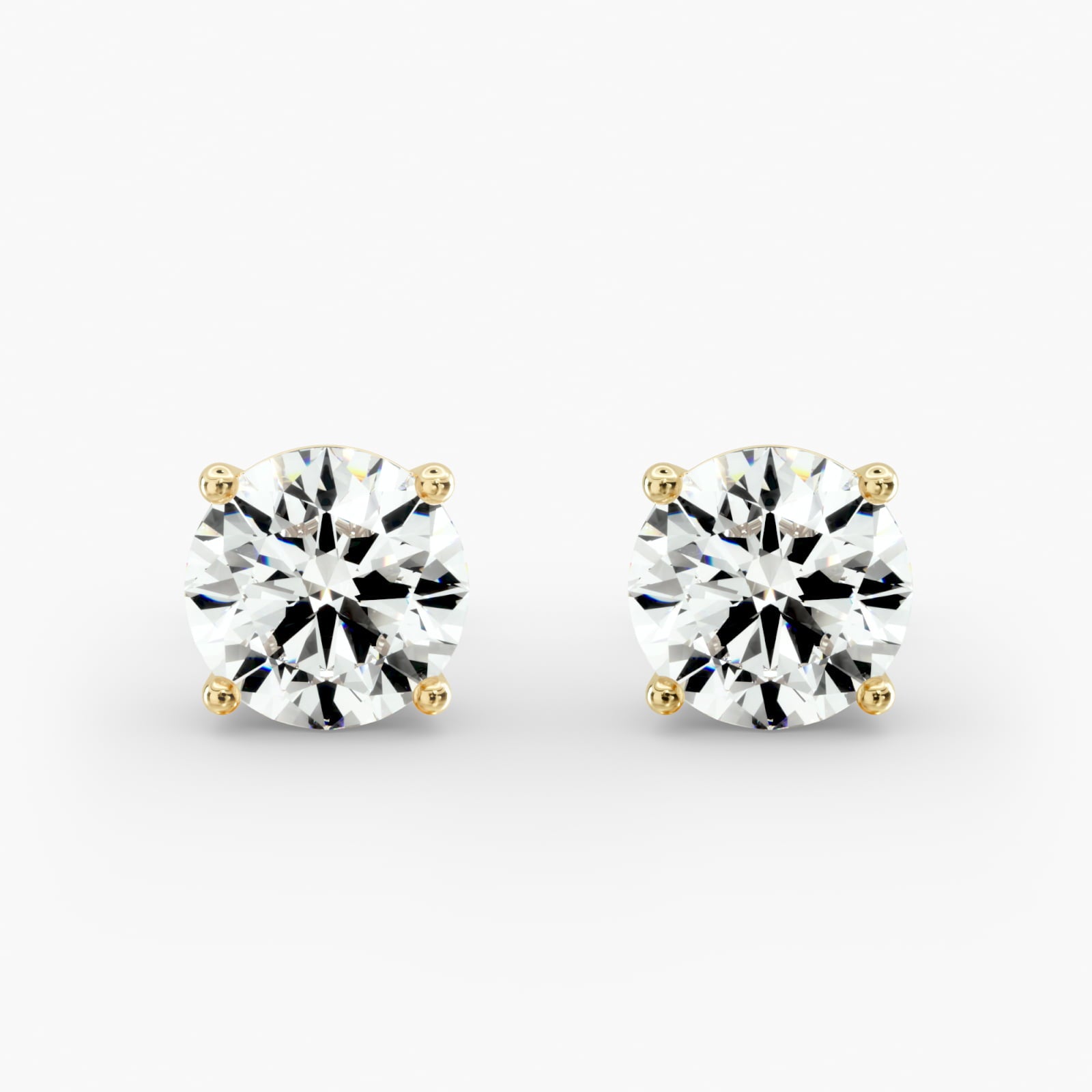Round Diamond Four‑Prong Stud Earrings 0.50–10.00 CT in 10K/14K/18K White or Yellow Gold