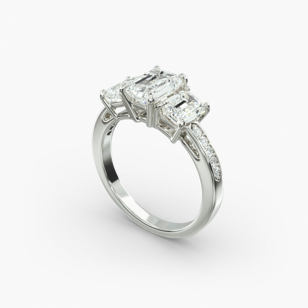 18K Gold Emerald And Round Shape Three Stone Engagement Ring