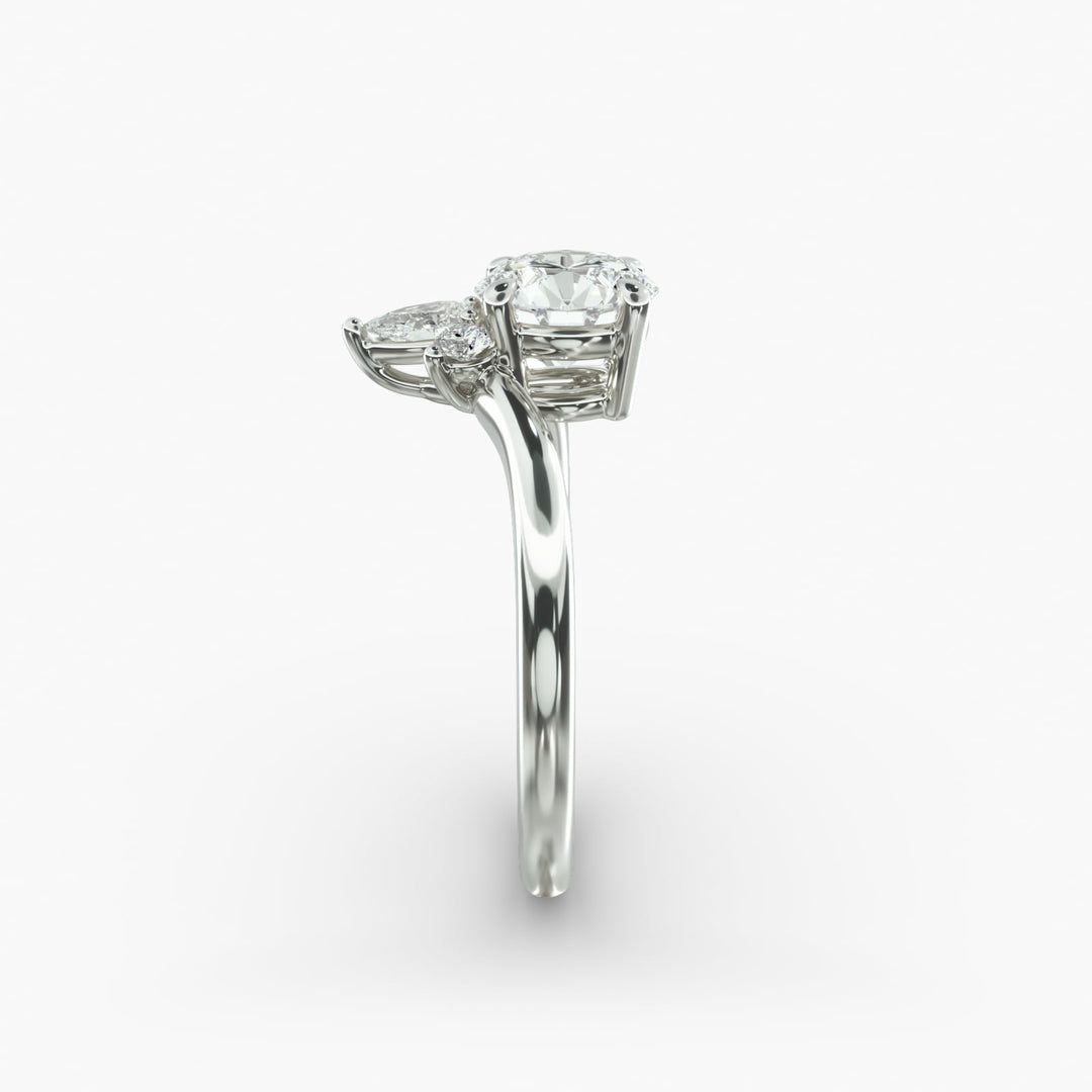 14K Gold Round And Pear Three Stone Curved Diamond Ring