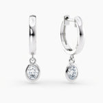 Load image into Gallery viewer, Oval Lab-Grown Diamond Bezel-Set Huggie Earrings 0.50 CTW – 2 Stones | 10K, 14K, 18K White, Yellow &amp; Rose Gold | IGI Certified
