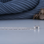 Load image into Gallery viewer, 10K White Gold Emerald Cut Diamond Bezel Solitaire Pendant Necklace
