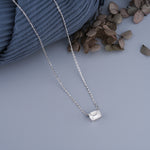 Load image into Gallery viewer, 10K White Gold Emerald Cut Diamond Four Prong Solitaire Pendant Necklace
