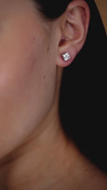 Load and play video in Gallery viewer, 2.05 CTW Princess Lab-Grown Diamond Stud Earrings in 14K Yellow Gold – IGI Certified
